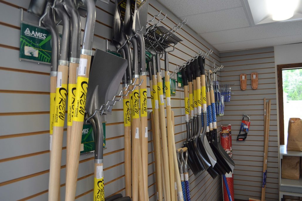 display of lots of shovels on a slat wall